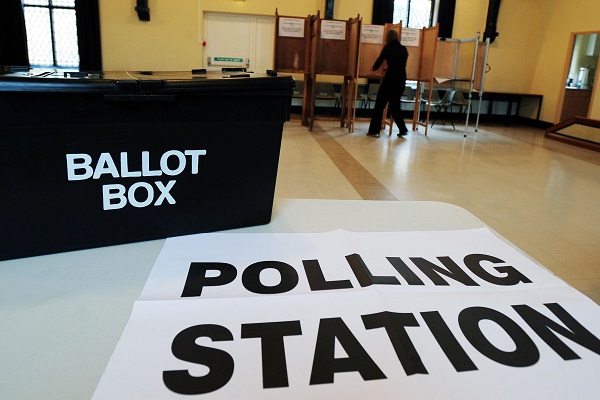 Polling station with a ballot box displayed-Life in the UK test-Testpreptraining.com